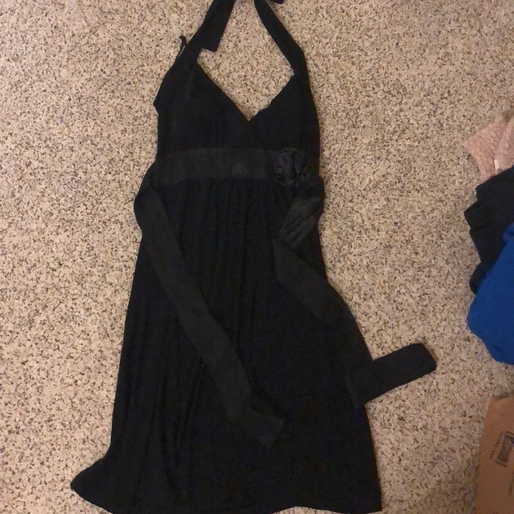 Black halter dress with sash and flower on waist